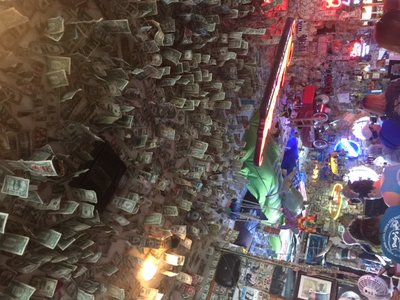Dollar bills hanging on the ceiling at Dusty’s Oyster Bar.