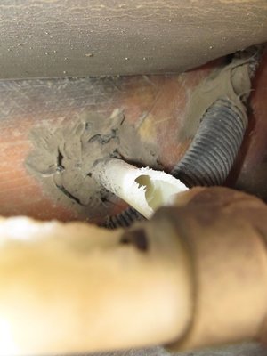 piping come down through floor and turning into cross piece.jpg
